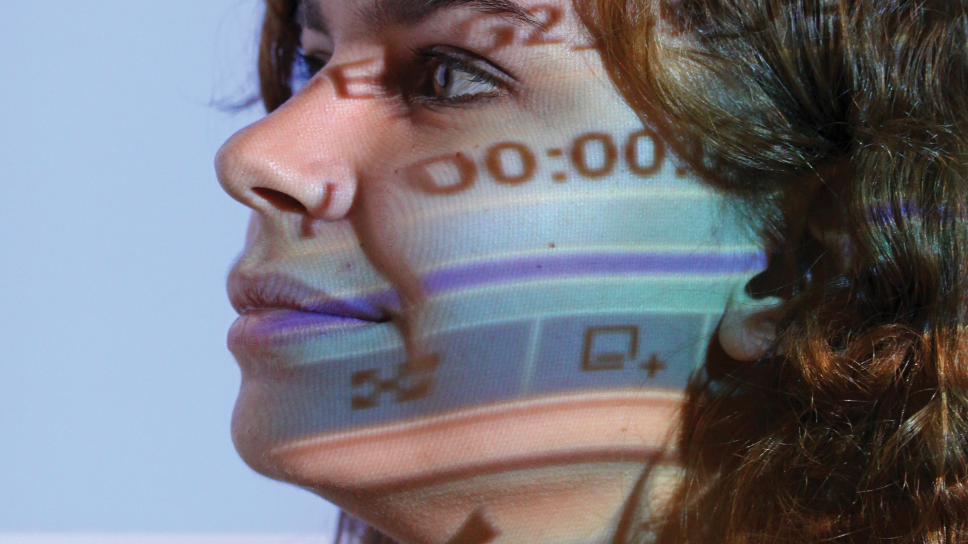 Woman with light from projector